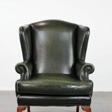 Smooth classic cowhide Chesterfield armchair in a stylish dark green color