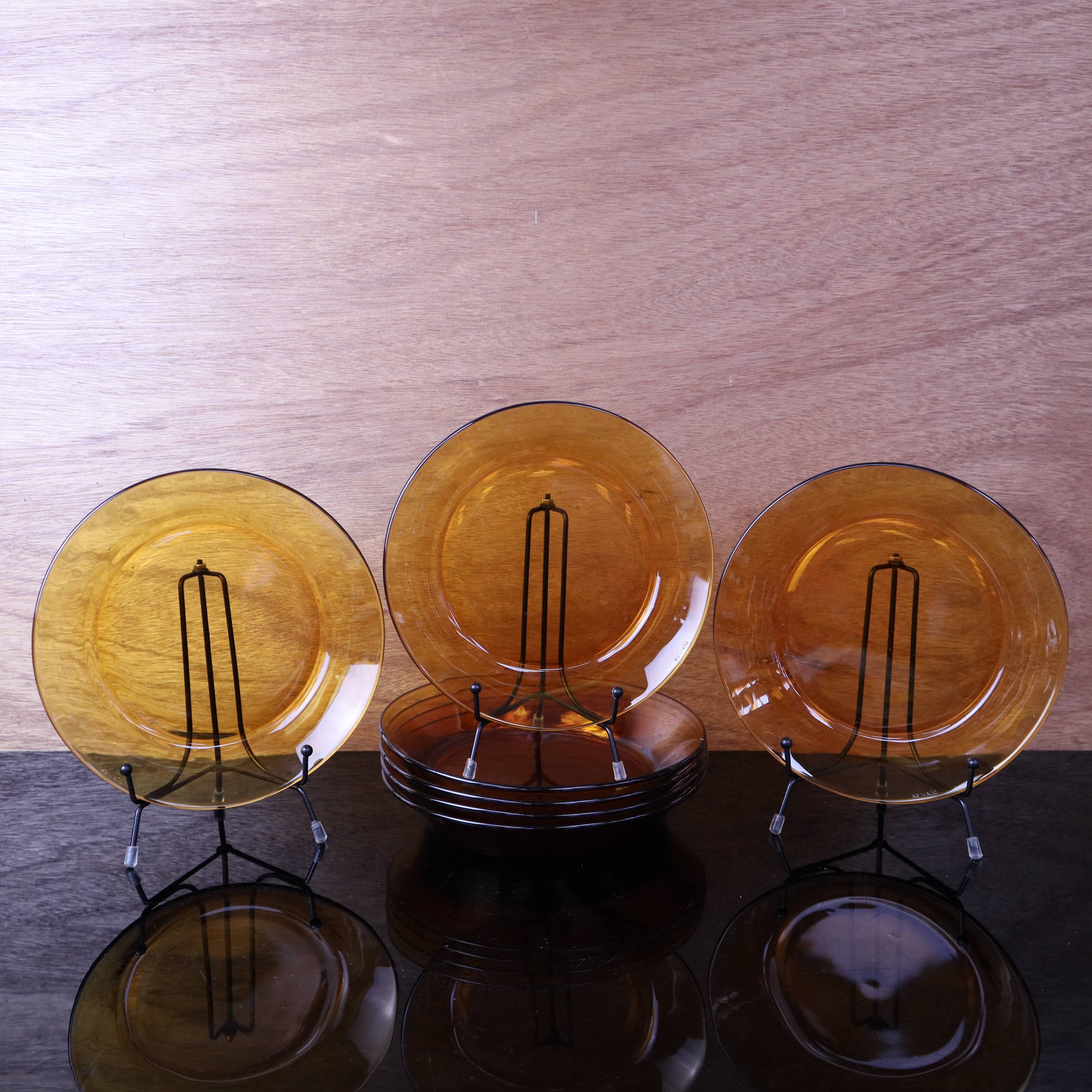 Set of 7 amber Duralex deep plates.