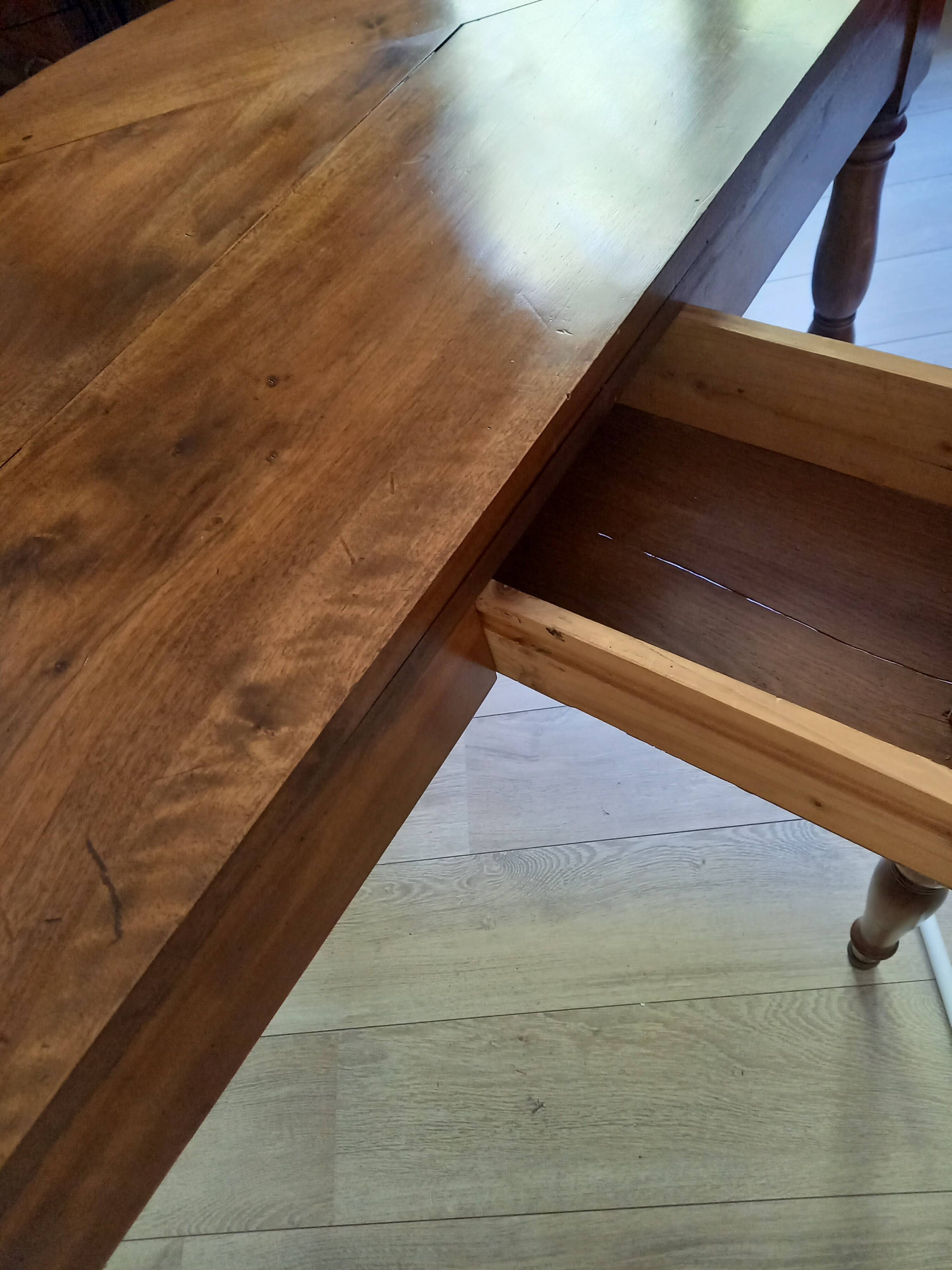 Antique half-moon walnut round table
