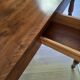 Antique half-moon walnut round table