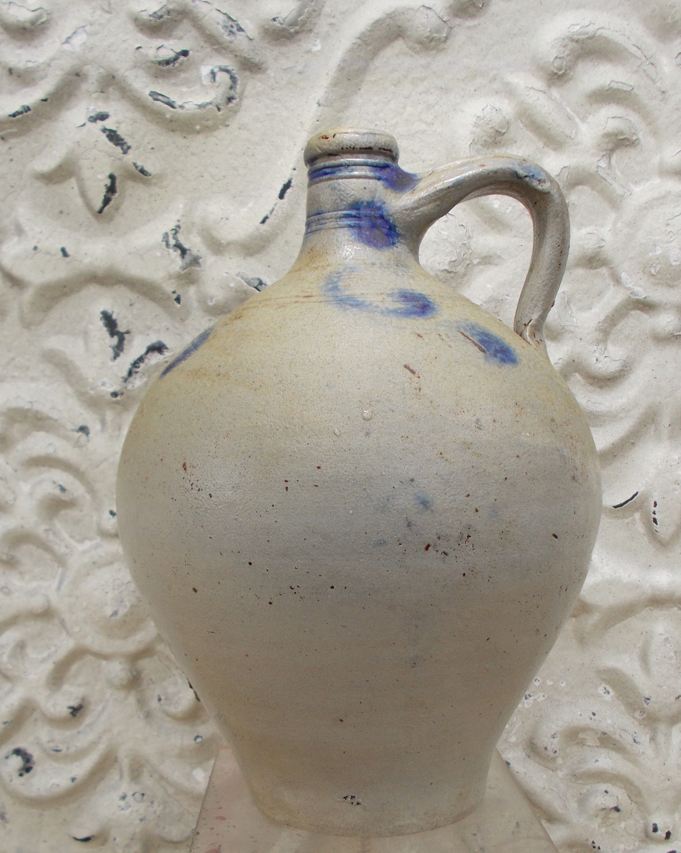 Old potiche jug in sandstone of Alsace