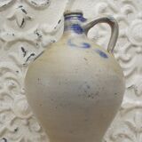 Old potiche jug in sandstone of Alsace