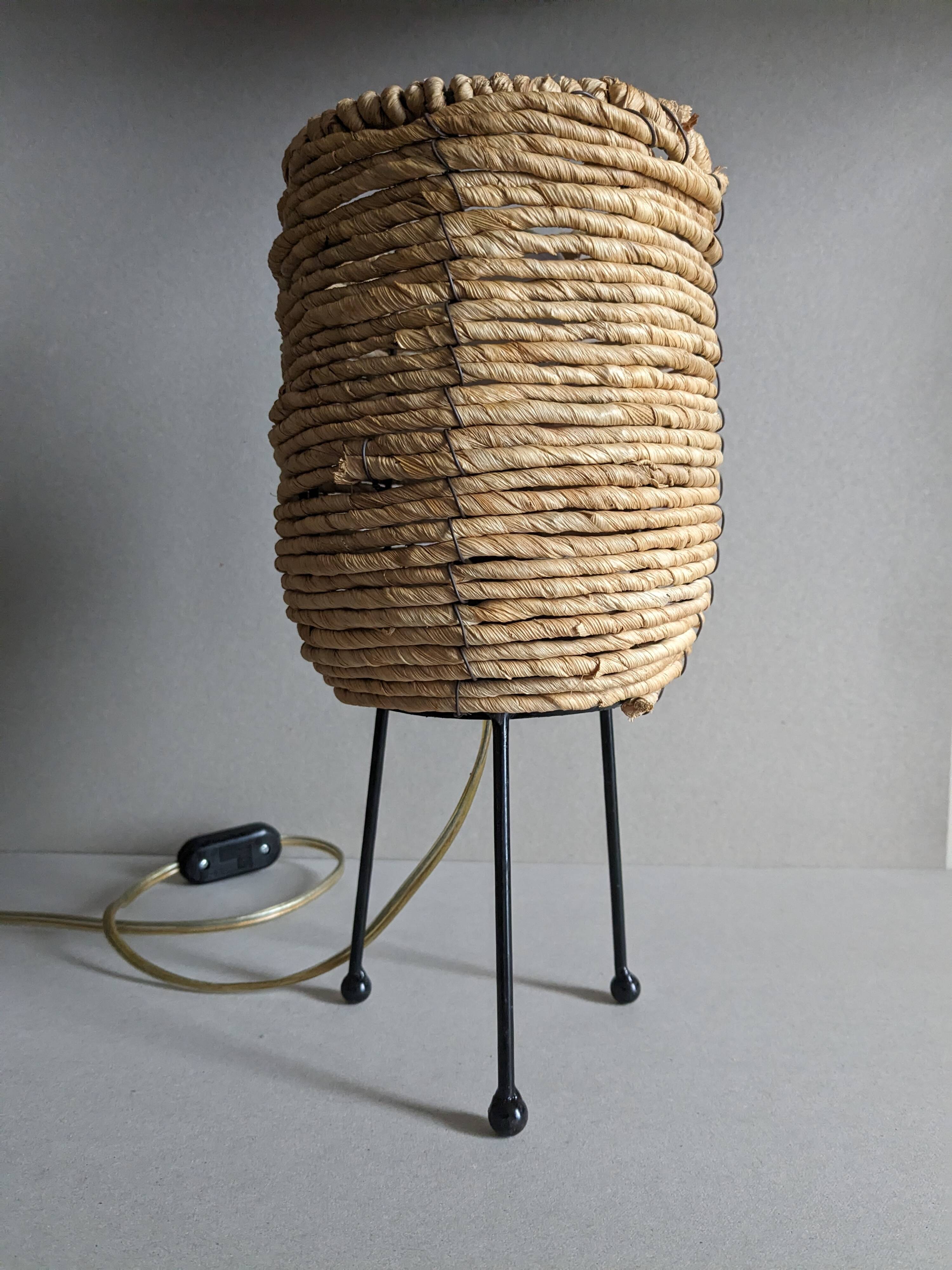Fiber and metal tripod lamp
