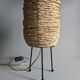 Fiber and metal tripod lamp