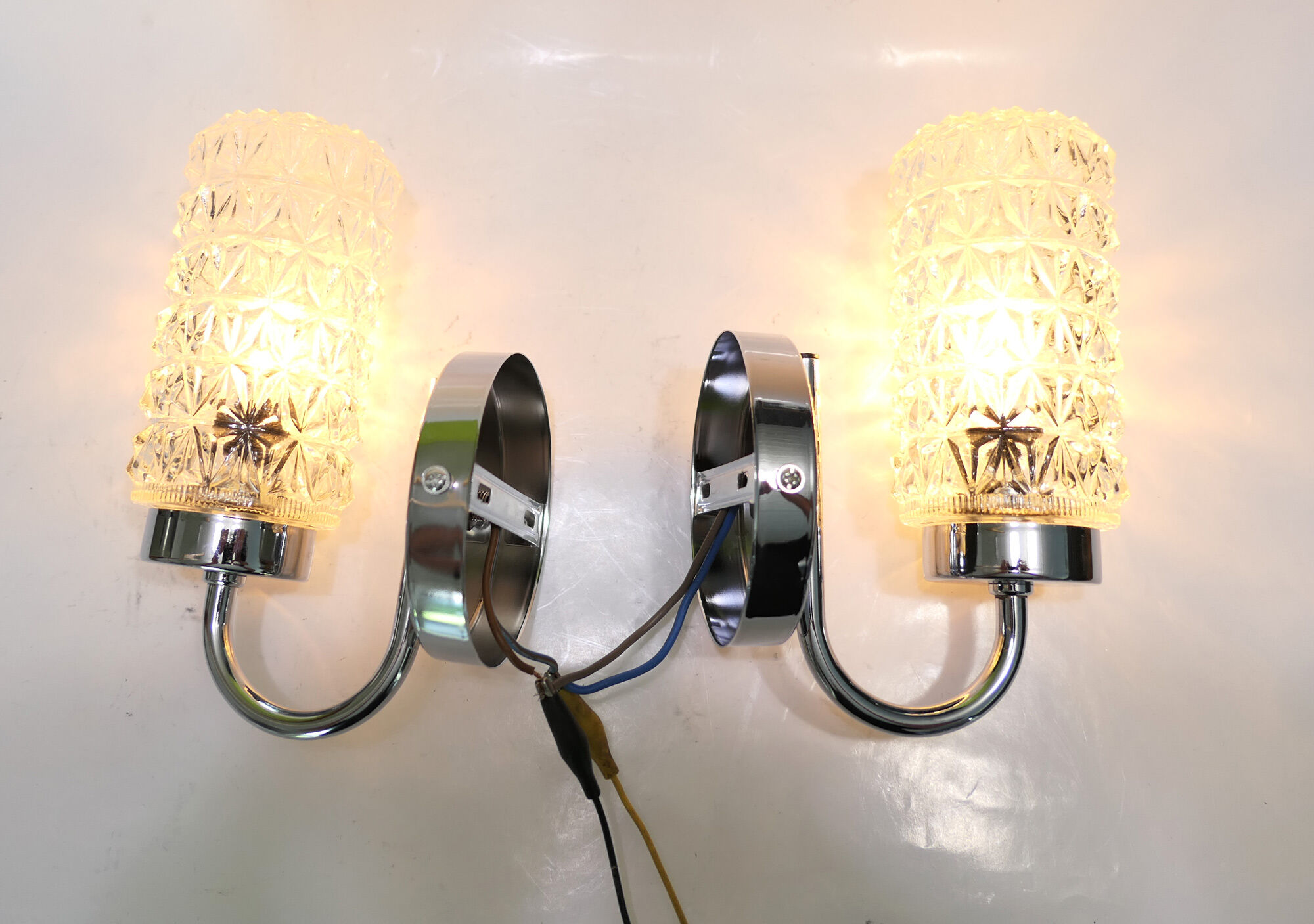 Pair of 1970 chrome metal wall light and molded glass globes.