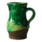 Glazed ceramic pitcher in green and brown by the potter Pierre Roulot.
