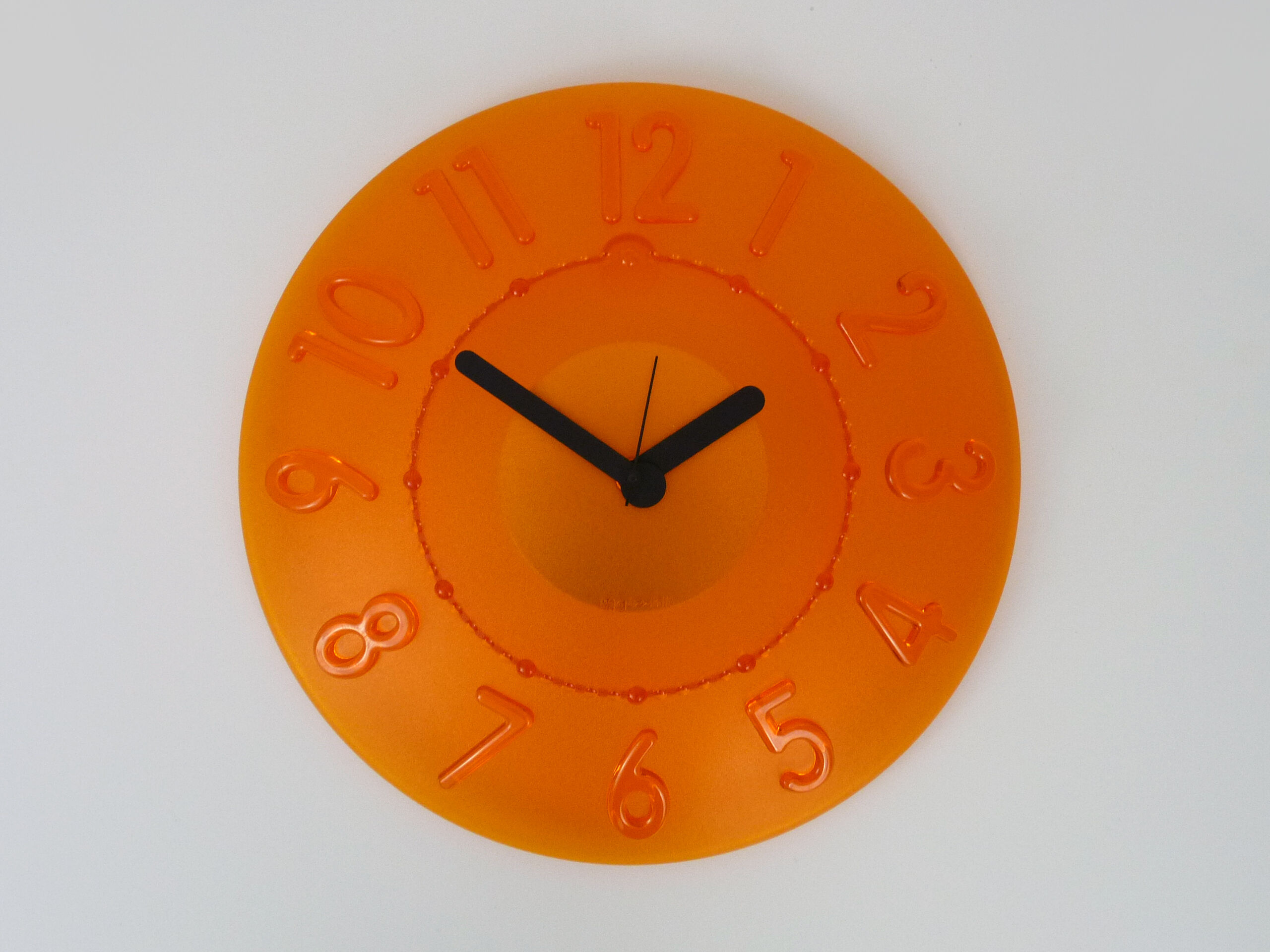 Guzzini orange wall clock from the 1980s