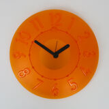 Guzzini orange wall clock from the 1980s