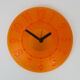 Guzzini orange wall clock from the 1980s