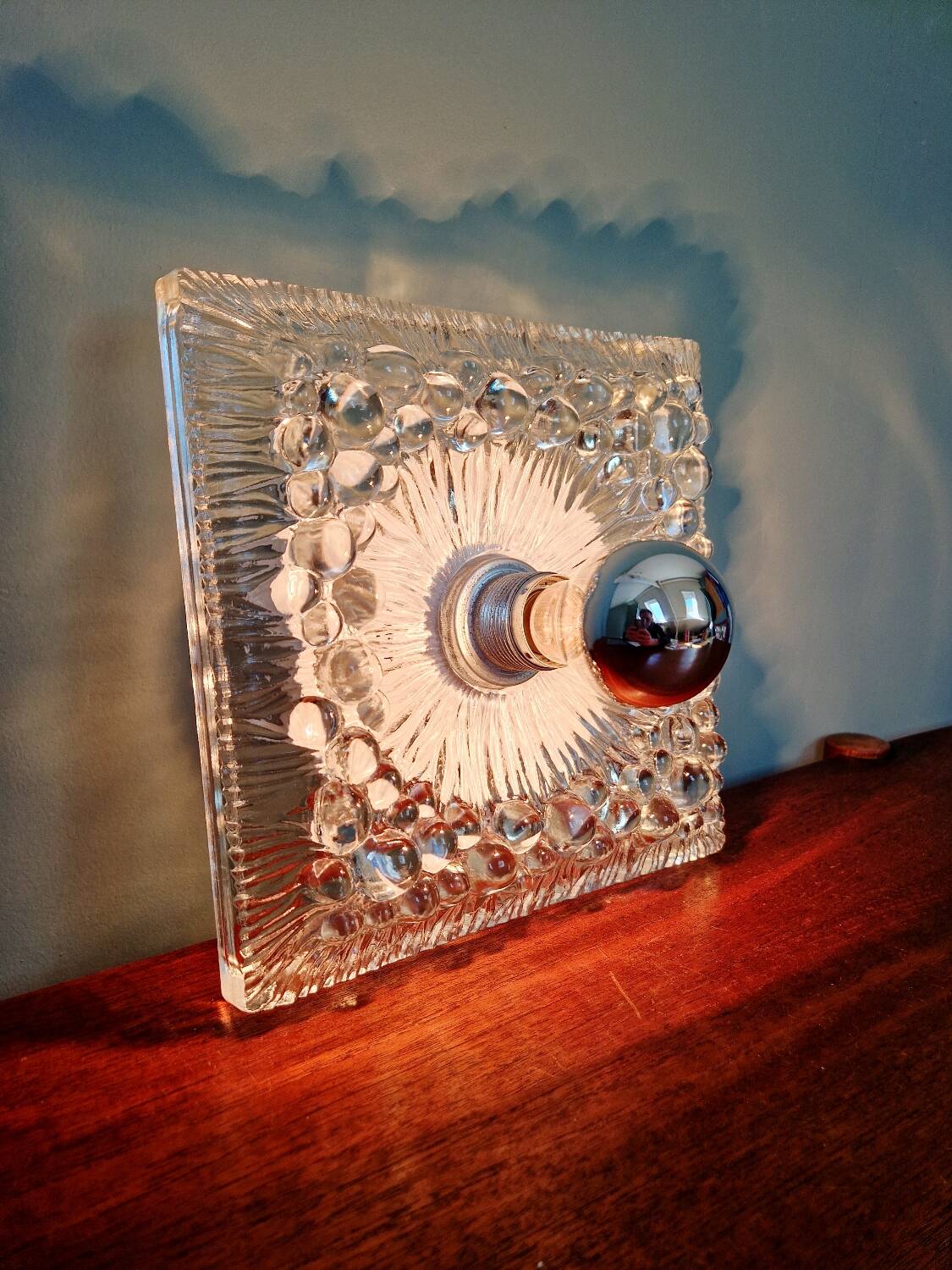 Space Age wall light in pressed transparent moulded glass, 1970.