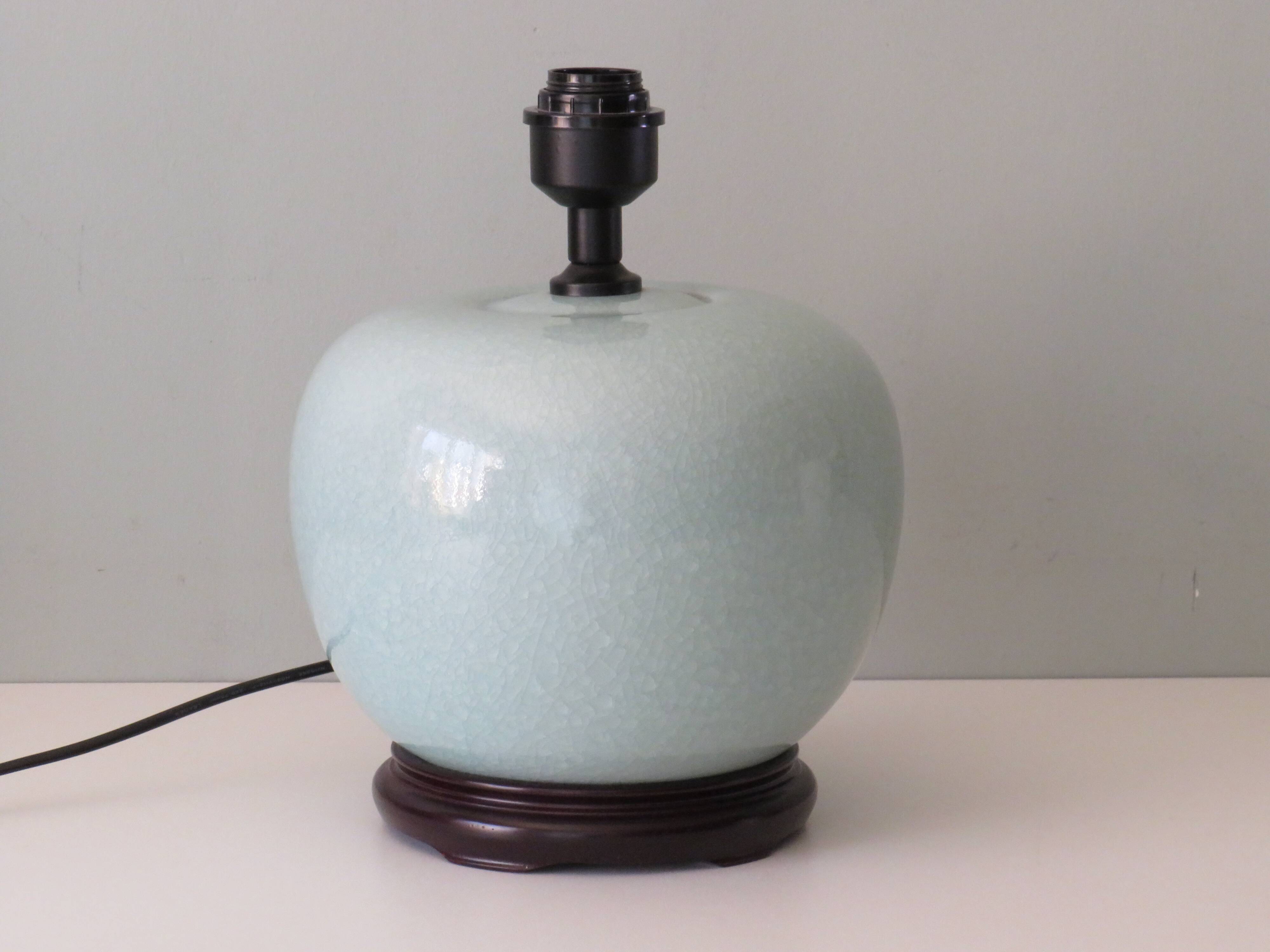Celadon-colored cracked ceramic table lamp with new personalized lampshade.