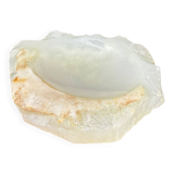 Empty pocket bowl made of translucent natural stone.