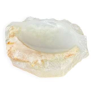 Empty pocket bowl made of translucent natural stone.