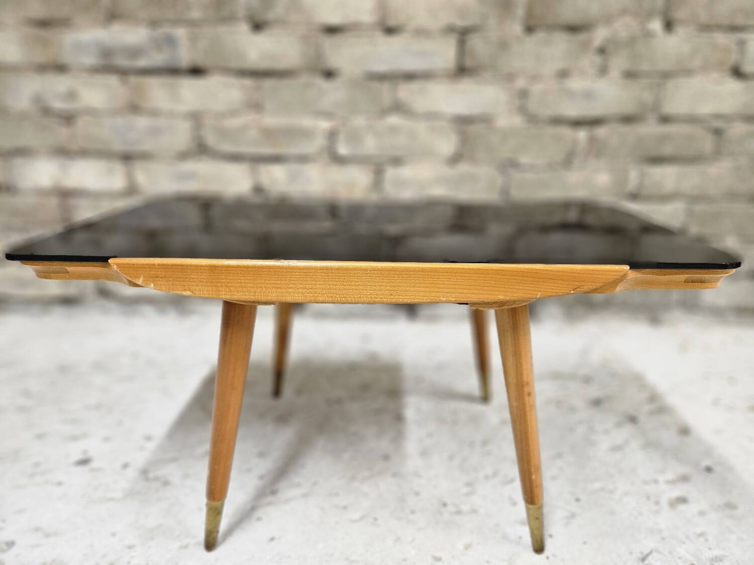 Small opaque black glass coffee table 1960