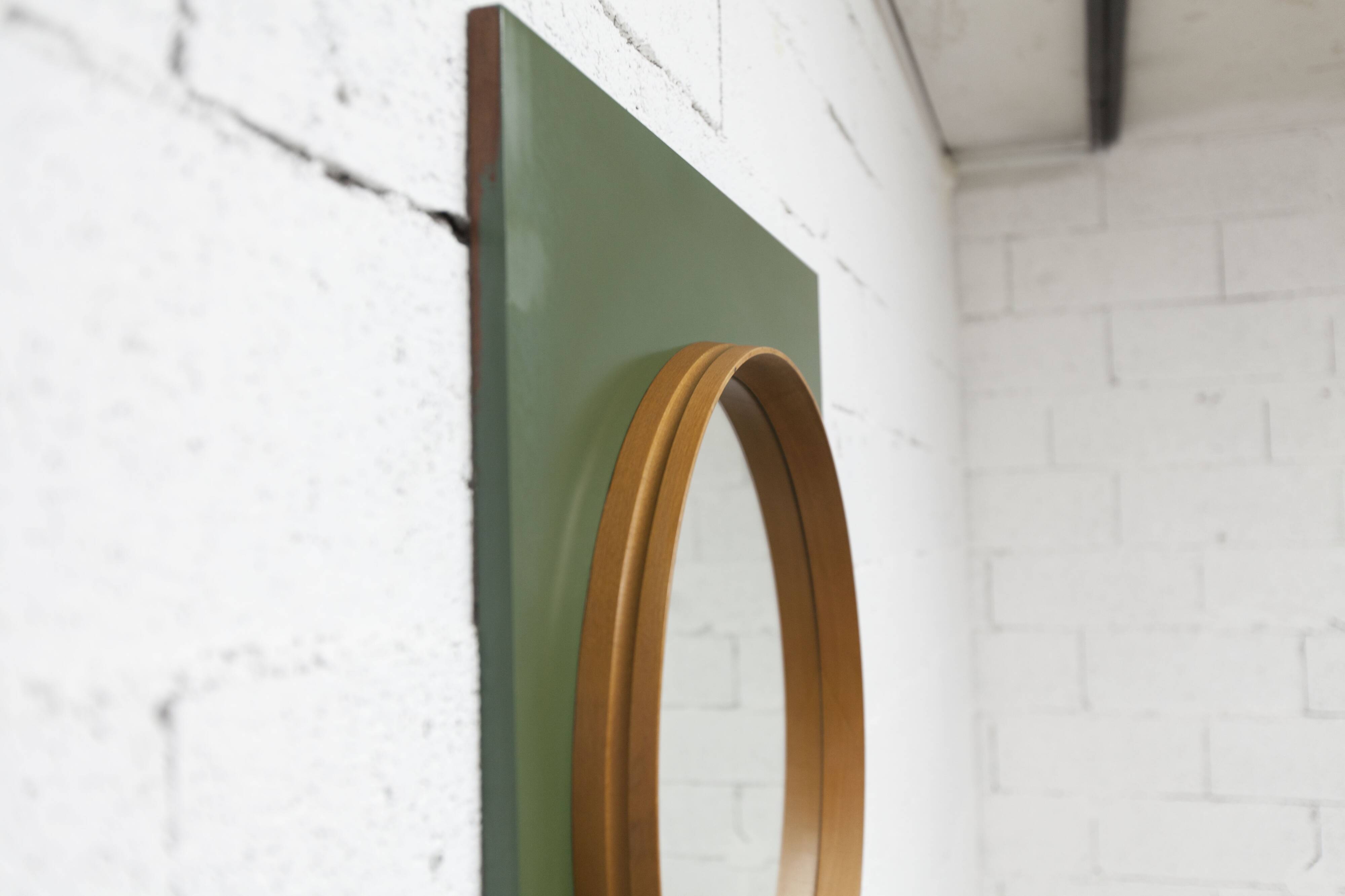Unusual round wall mirror 60 cm teak edge on green rectangular board 1960.
