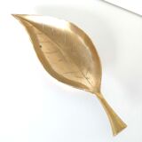 Empty brass leaf pocket