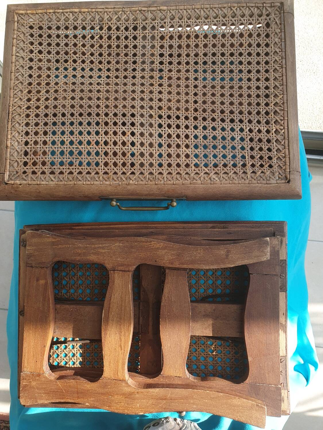 Two folding stools with caned seats.