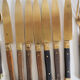 Set of old dessert cutlery in wood and brass