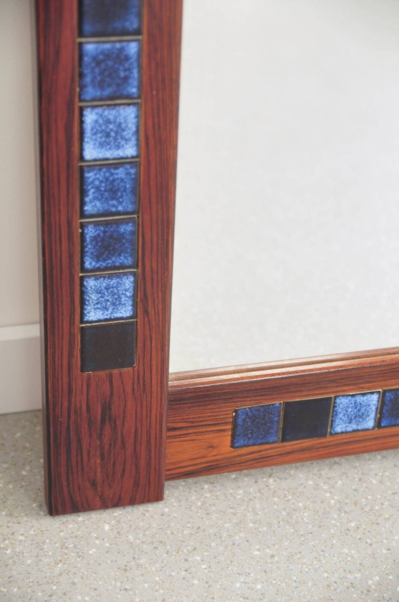 Rosewood mirror with blue ceramic tiles