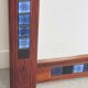 Rosewood mirror with blue ceramic tiles