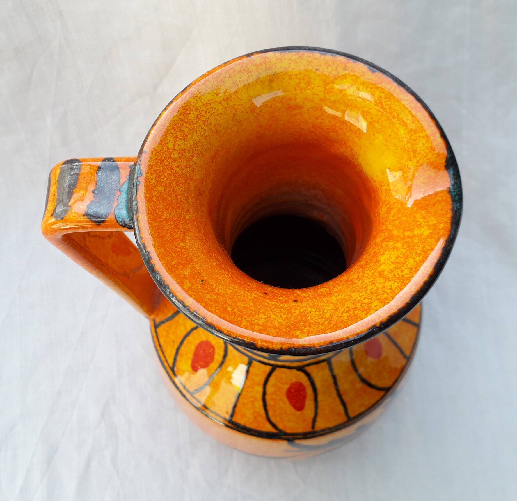 Orange ceramic jug