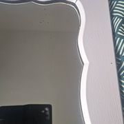 Mid-20th century rectangular wall mirror with a powder pink frame.