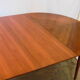 Mahogany round table with 4 extensions from the 1950s