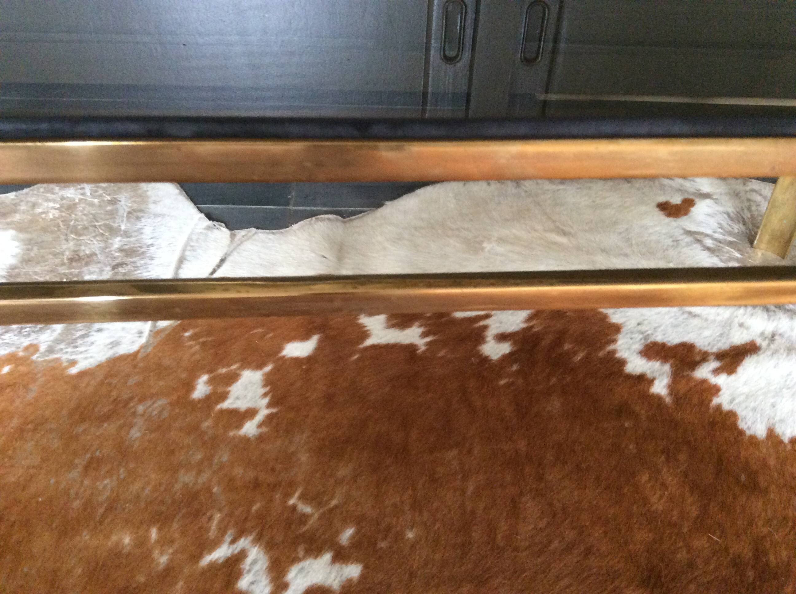 Glass and brass coffee table