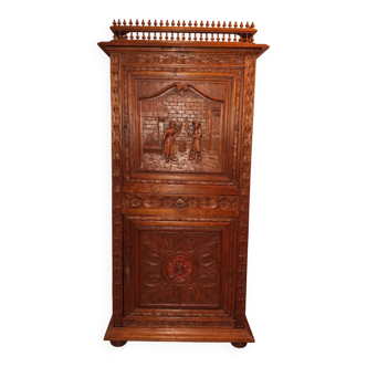 Antique carved oak wardrobe – figurative scene – late 19th century