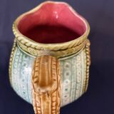 Small onnaing barbotine jug with lion decoration