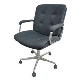 Black mottled fabric and chrome swivel armchair, 1