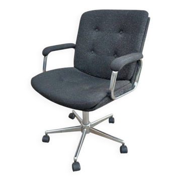Black mottled fabric and chrome swivel armchair, 1
