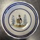 Large earthenware centerpiece dish with painted decoration of a drummer