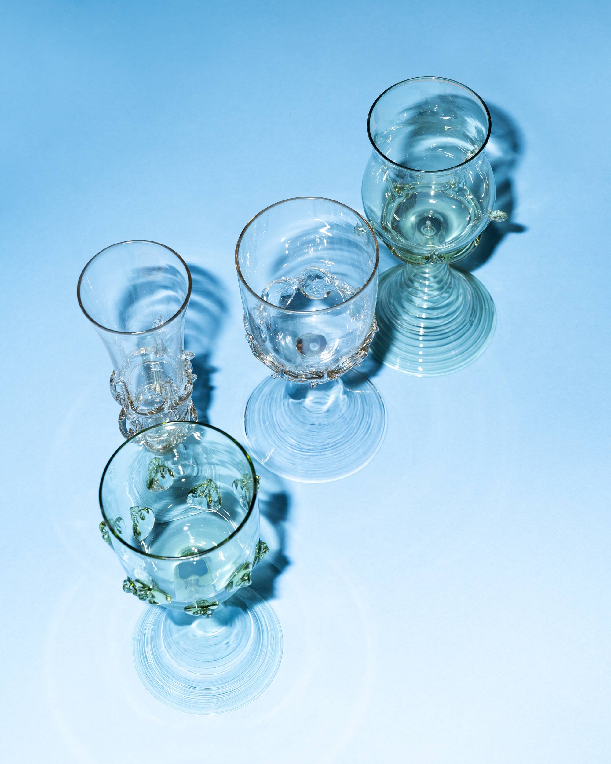 pair of green glass champagne flutes - points