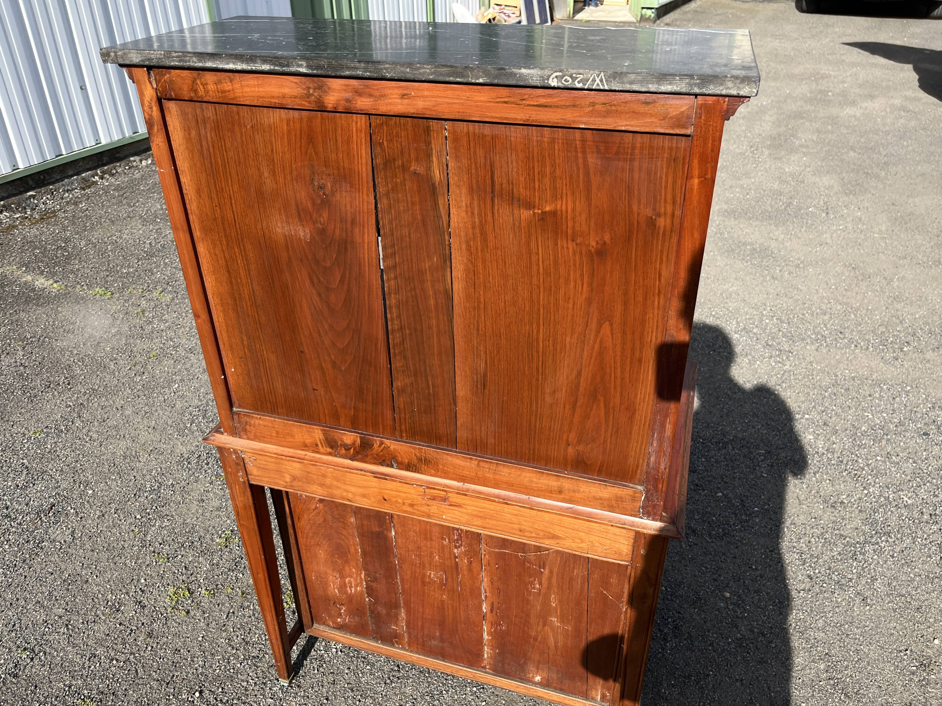 Victorian English two-body buffet with cherry wood on marble display case from the 19th century.