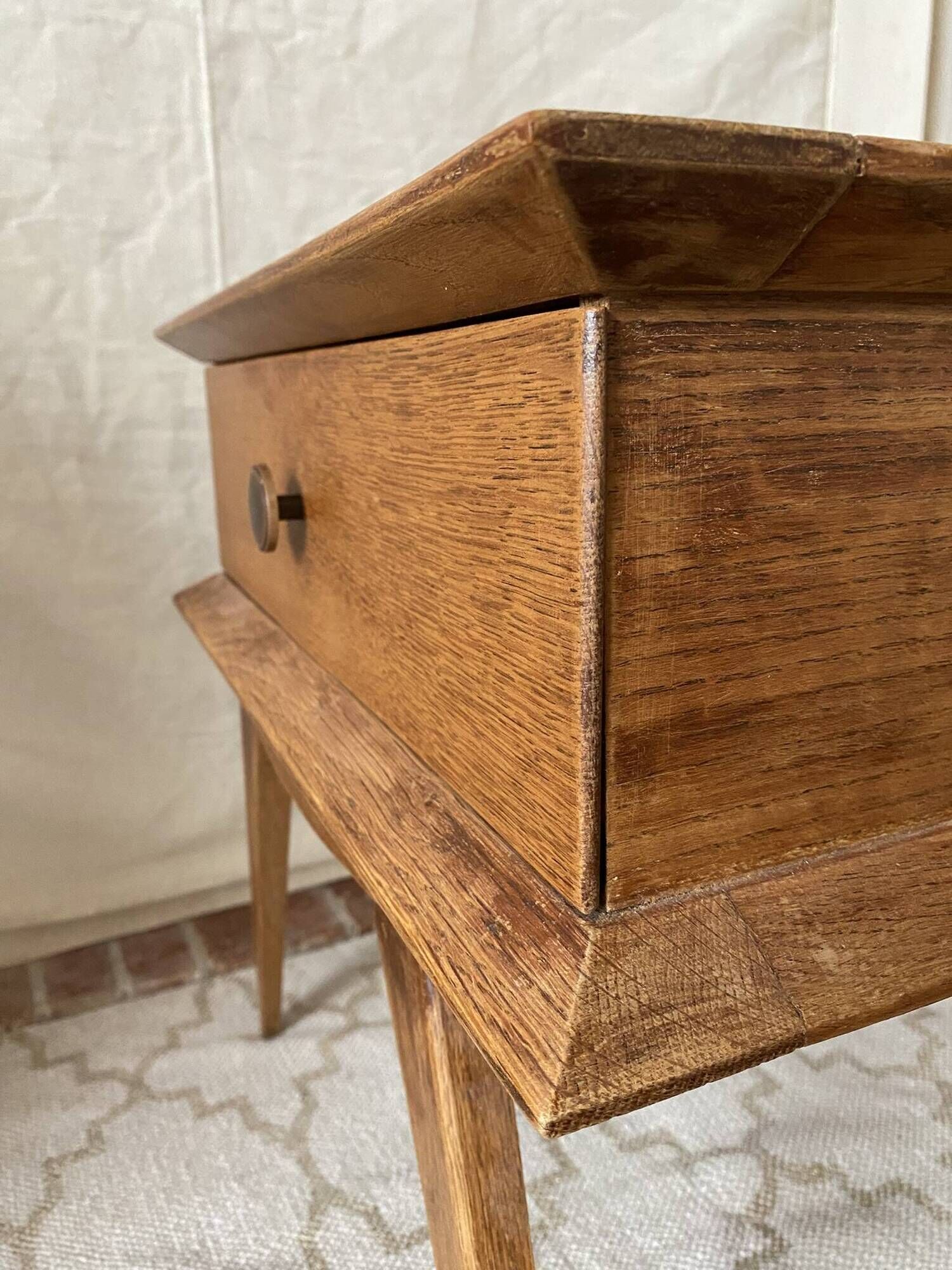 Scandinavian style bedside table with tapered legs from the 1960s.