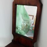 Wooden wall mirror with its shelf
