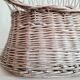 Antique armchair in gray woven wicker