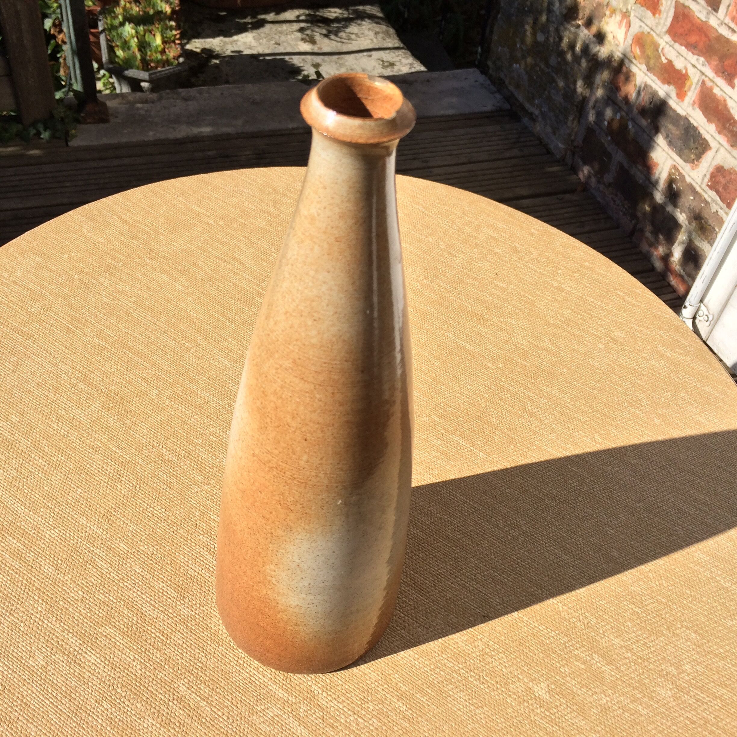Bottle in sandstone or doilies
