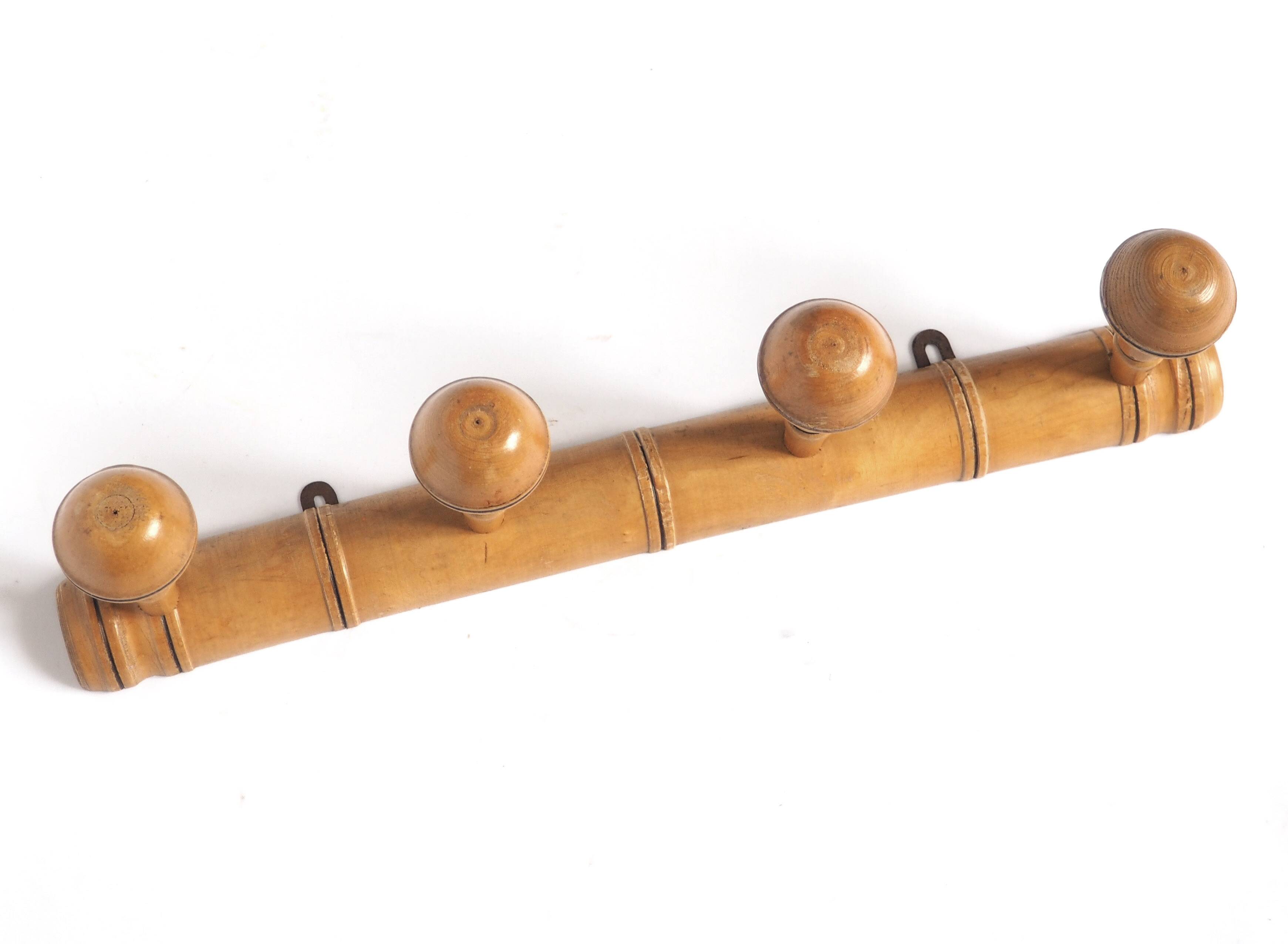 Light wood coat hooks 1900