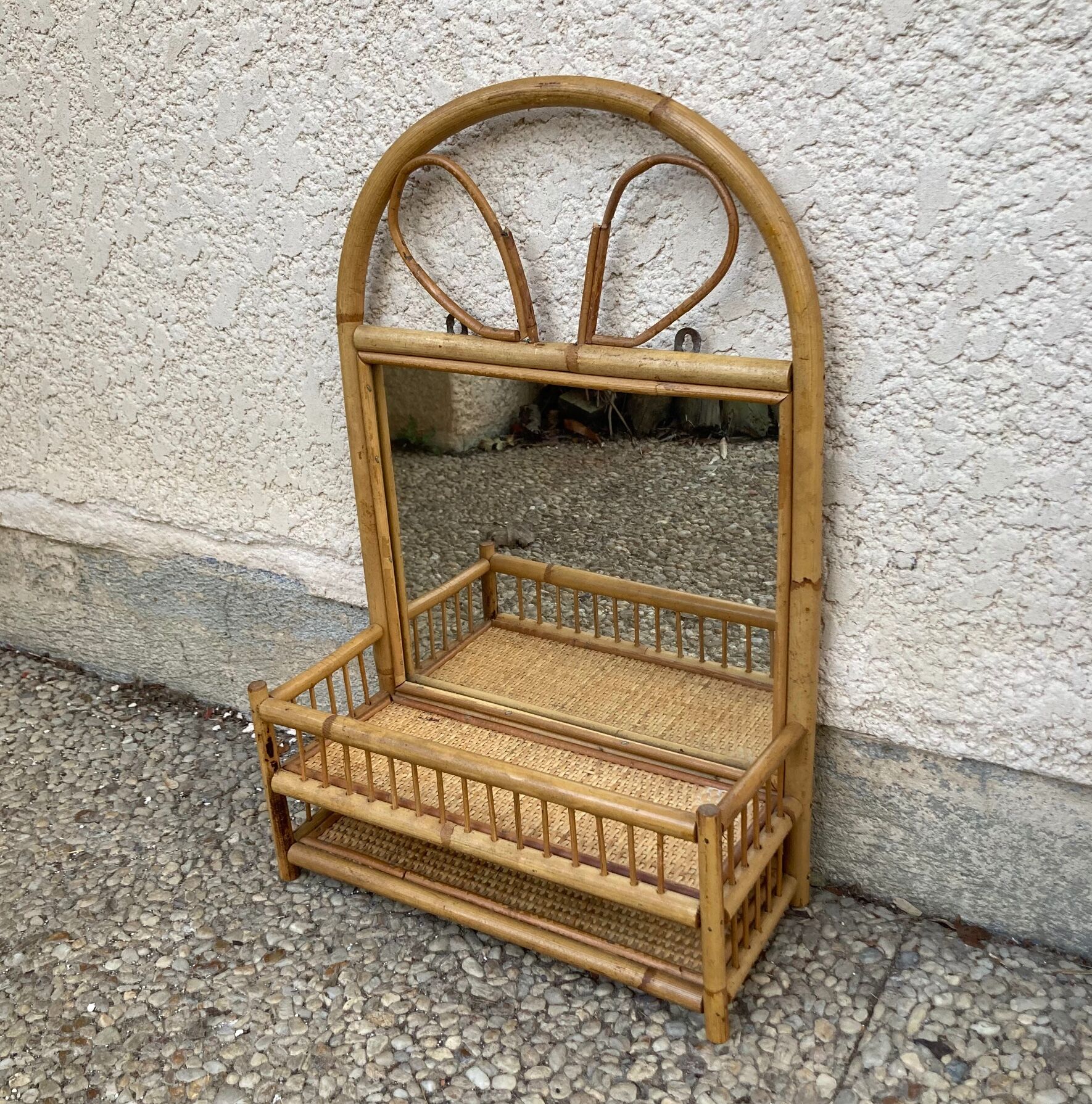 Vintage rattan wall shelf with mirror