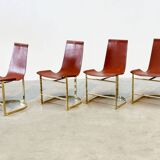 Set of four leather and brass Italian dining chairs
