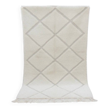 Small white Moroccan rug with diamond patterns