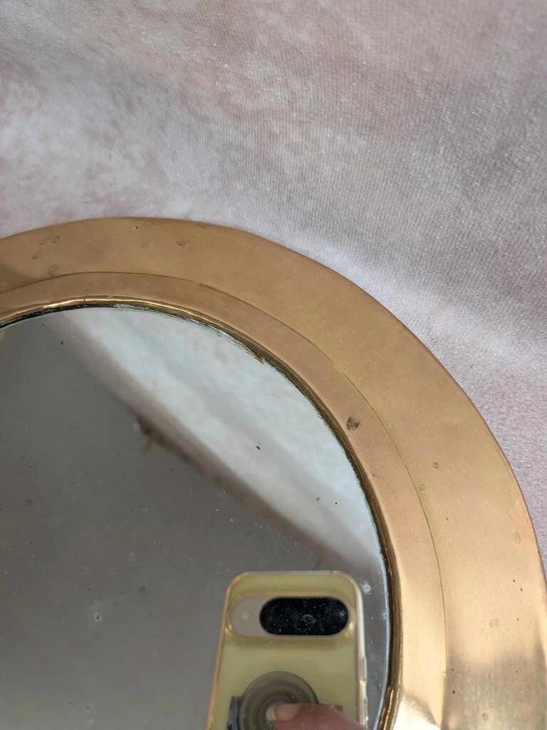 Vintage Moroccan wall mirror in brass, arch shape.