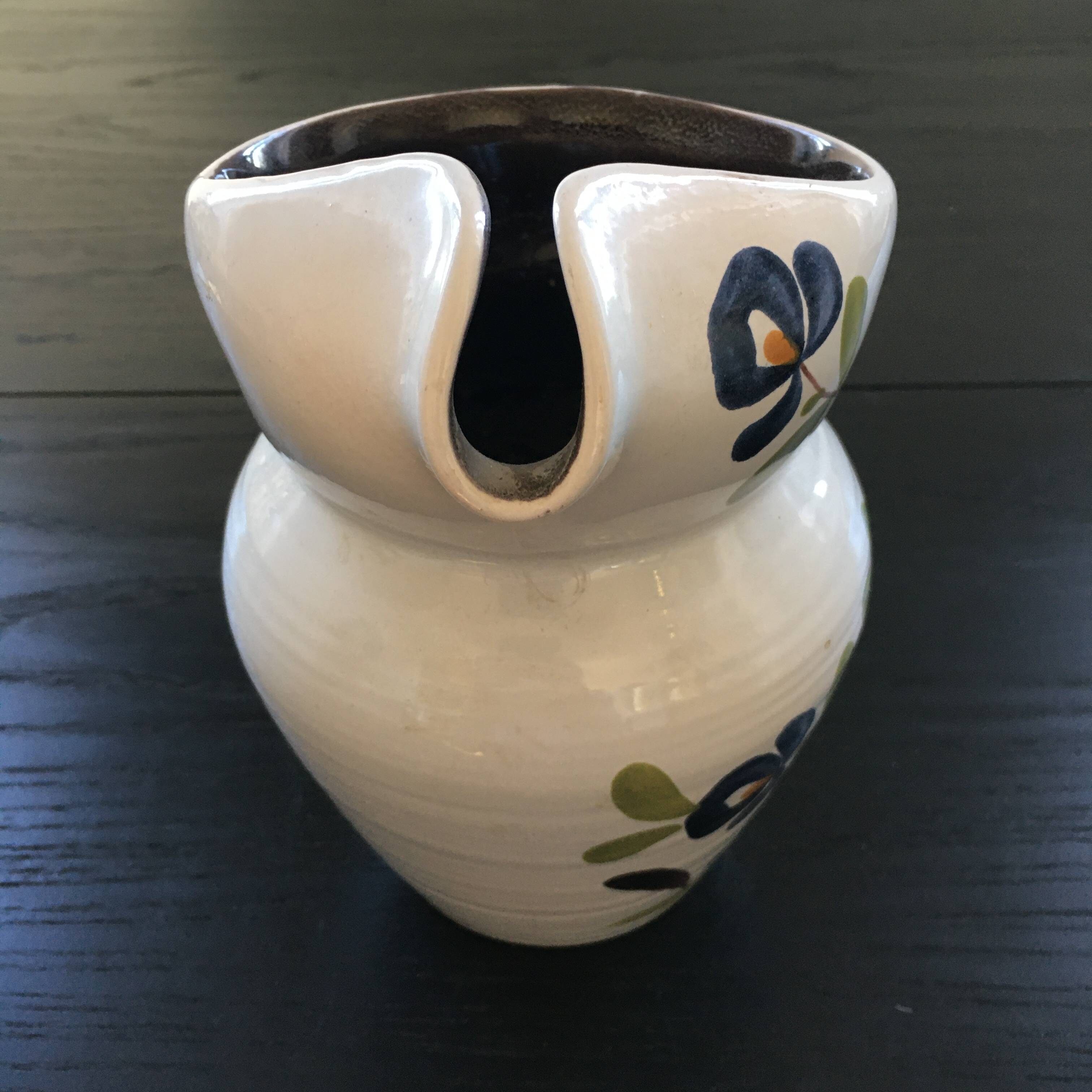 White pitcher with floral decoration