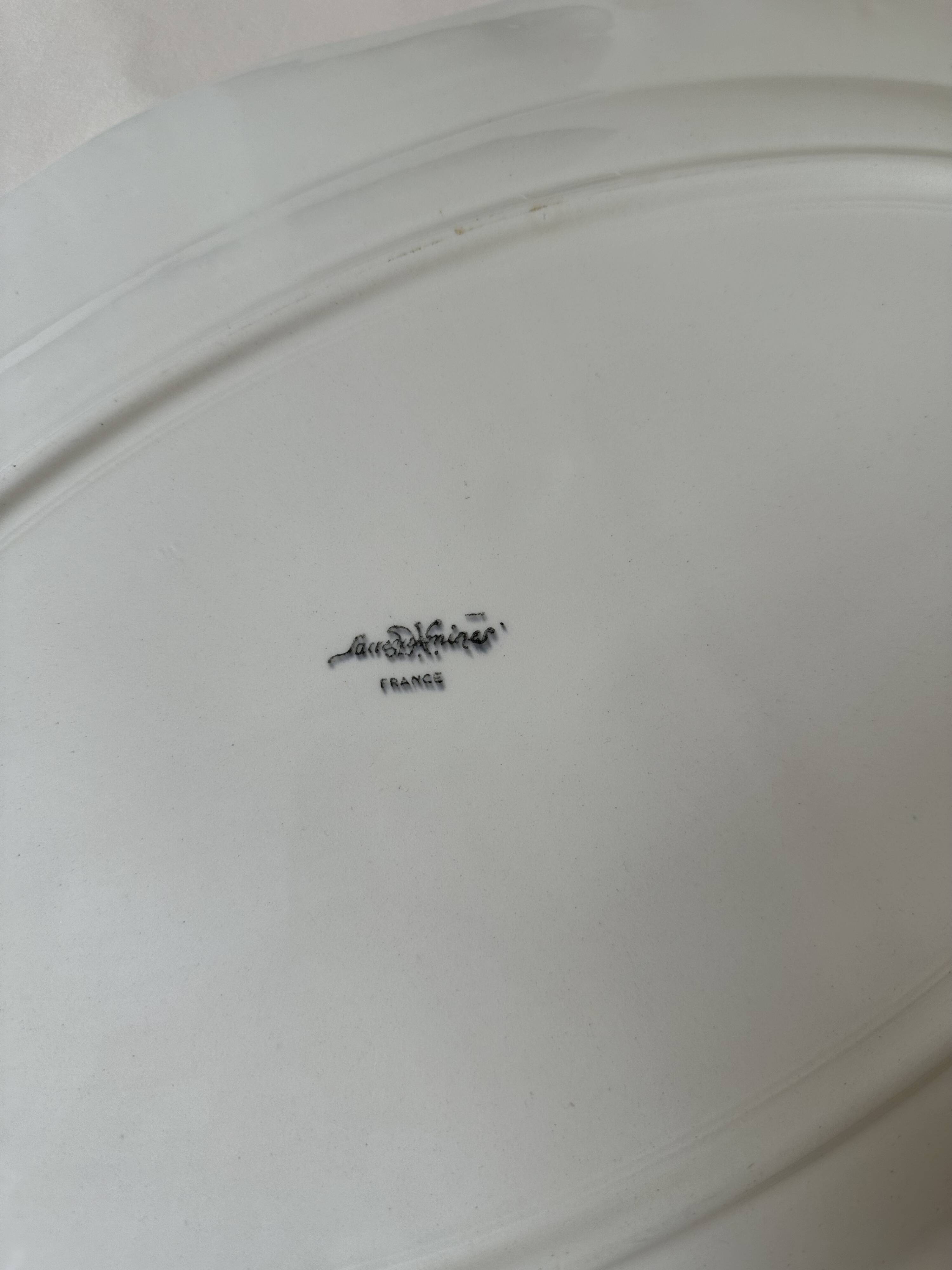 Shaped plates and dishes in Sarreguemines earthenware.