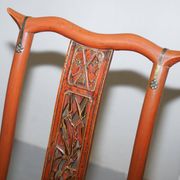 Antique Chinese folding chair with carvings, circa 1900-1920.