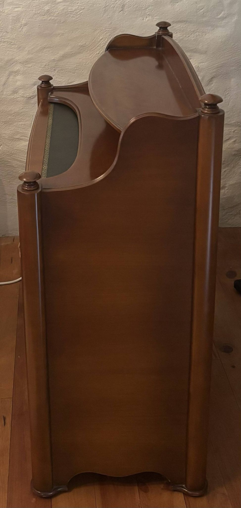 Vintage drop-leaf secretary with a green leather top and inlays.