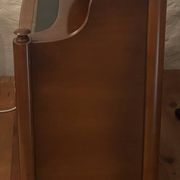 Vintage drop-leaf secretary with a green leather top and inlays.