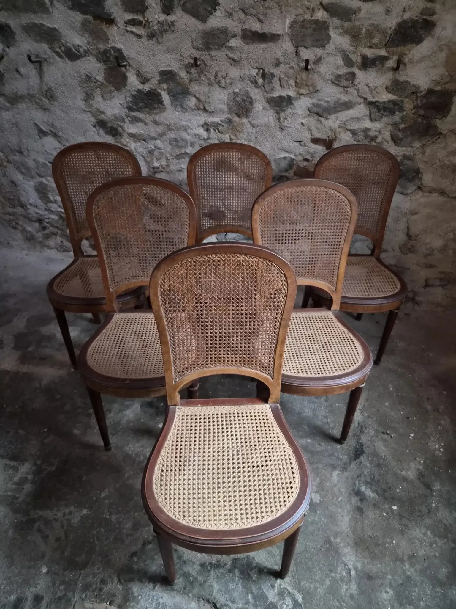 Set of 6 antique Louis XVI style dining chairs with caning.